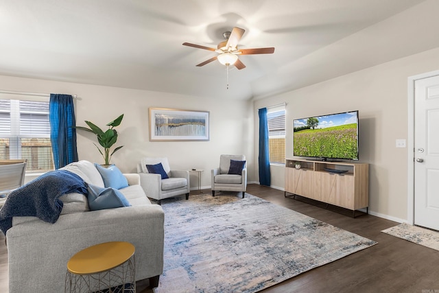 living room with ceiling fan, dark hardwood / wood-style flooring, and a wealth of natural light