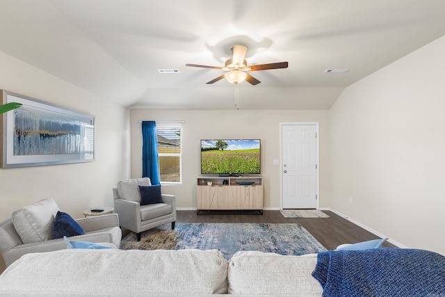 living room featuring ceiling fan, dark wood-type flooring, and vaulted ceiling