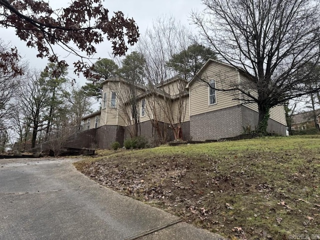 view of side of home featuring a yard