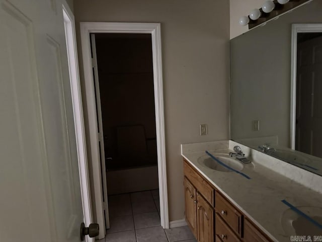 bathroom featuring tile patterned flooring and vanity