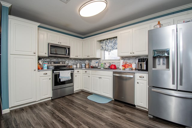 kitchen with appliances with stainless steel finishes, dark hardwood / wood-style flooring, tasteful backsplash, ornamental molding, and white cabinets