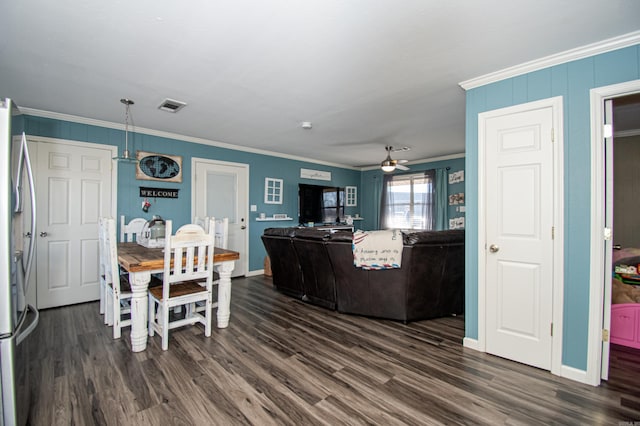 dining space featuring ceiling fan, dark hardwood / wood-style floors, and ornamental molding