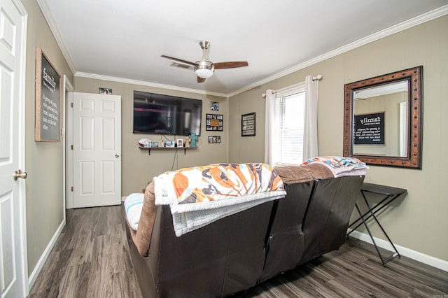 living room featuring hardwood / wood-style floors, ceiling fan, and ornamental molding