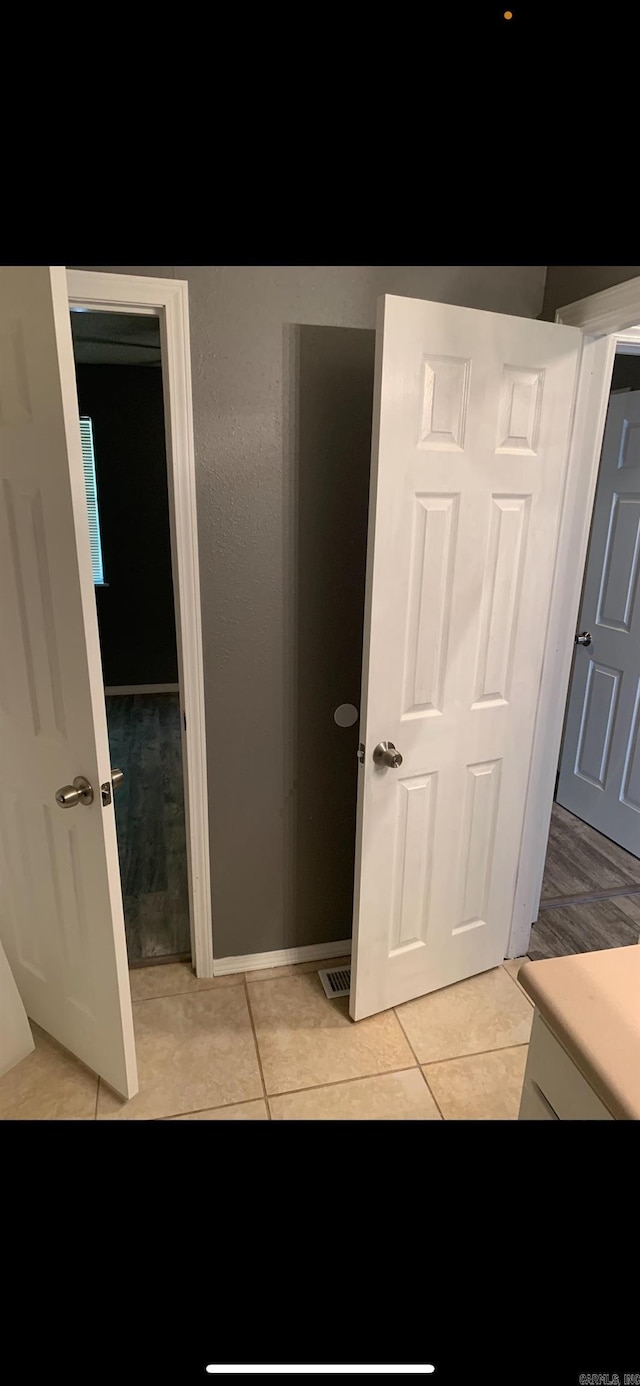 bathroom featuring tile patterned flooring