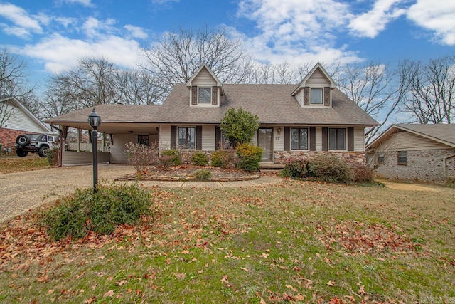 new england style home featuring a carport and a front lawn