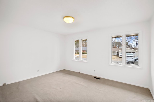 unfurnished room with carpet floors