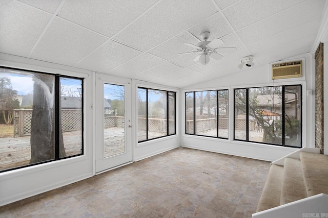 unfurnished sunroom featuring a paneled ceiling, ceiling fan, lofted ceiling, and a wall mounted AC