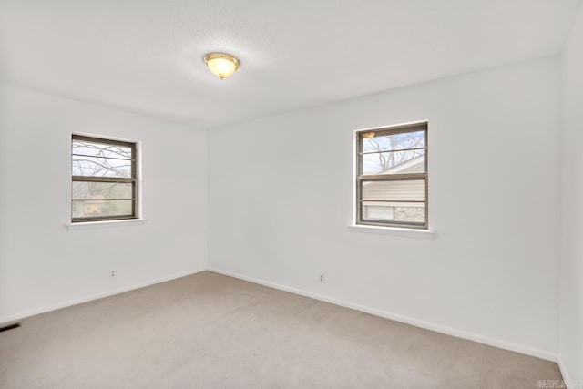 spare room featuring carpet floors