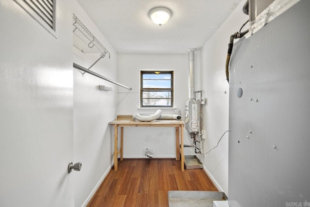 washroom featuring a textured ceiling and hardwood / wood-style flooring