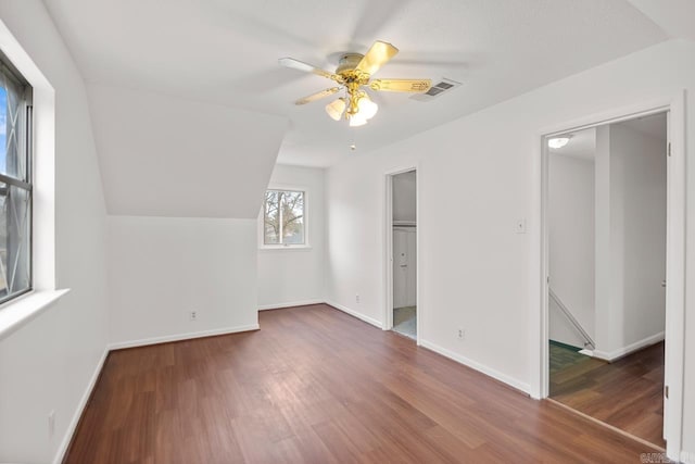 bonus room featuring ceiling fan, dark hardwood / wood-style flooring, and lofted ceiling