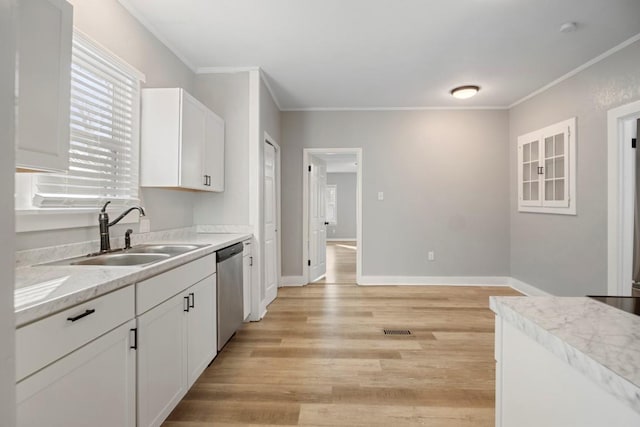 kitchen with sink, crown molding, light hardwood / wood-style flooring, dishwasher, and white cabinets