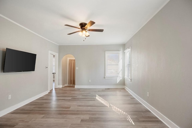 unfurnished room featuring ceiling fan and light hardwood / wood-style flooring