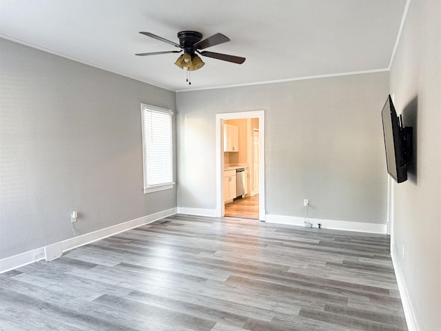 unfurnished room with crown molding, ceiling fan, and hardwood / wood-style flooring