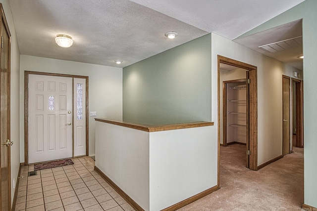 foyer featuring a textured ceiling