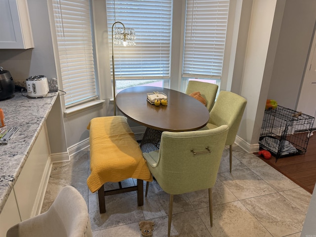 dining area with light tile patterned floors