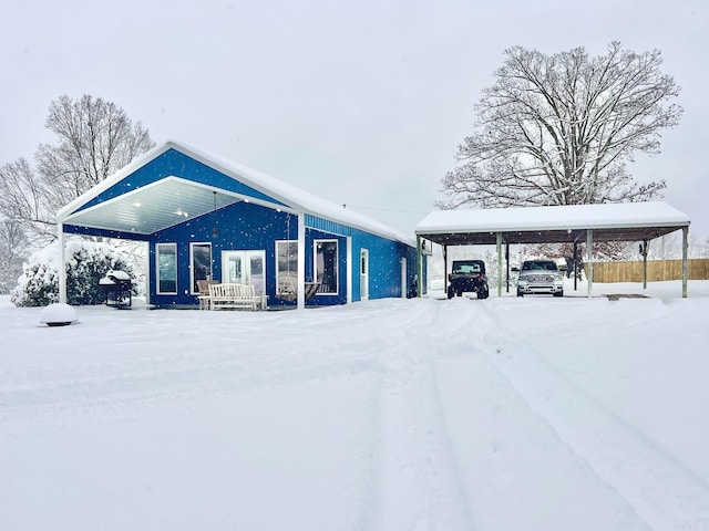 exterior space featuring a carport