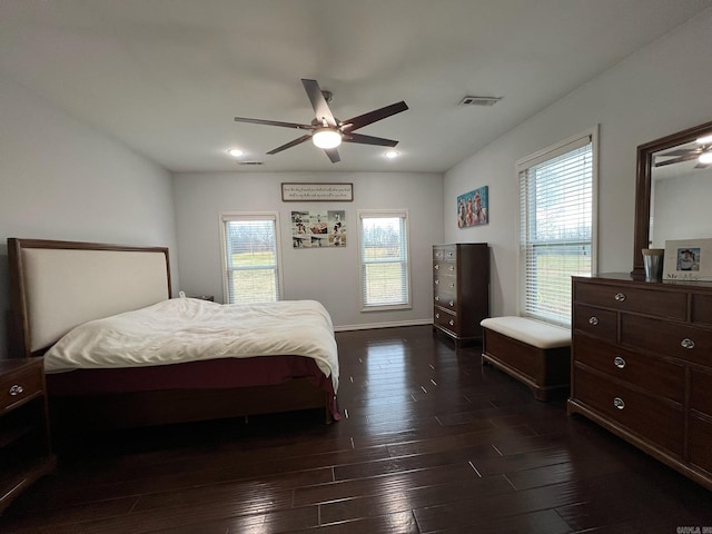 bedroom featuring ceiling fan and dark wood-type flooring