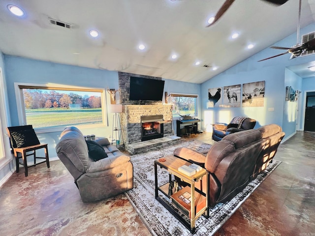 living room featuring a fireplace, concrete floors, vaulted ceiling, and ceiling fan