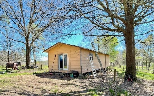 view of property exterior featuring an outdoor structure