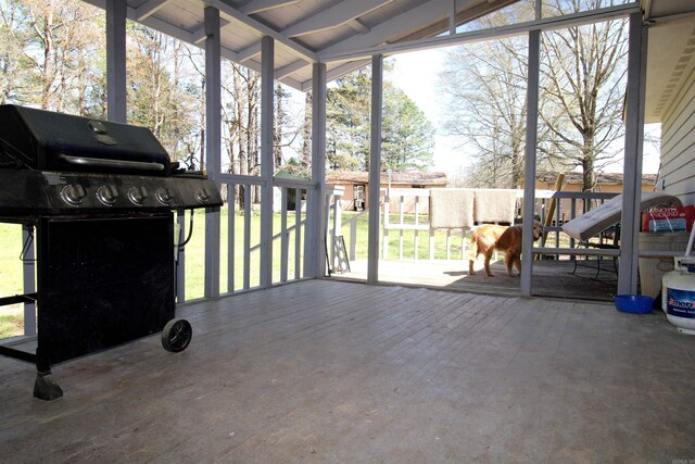 sunroom / solarium with lofted ceiling