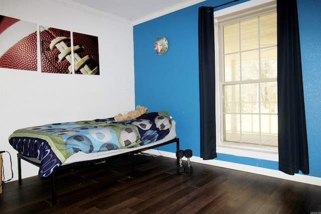 bedroom featuring hardwood / wood-style flooring and ornamental molding