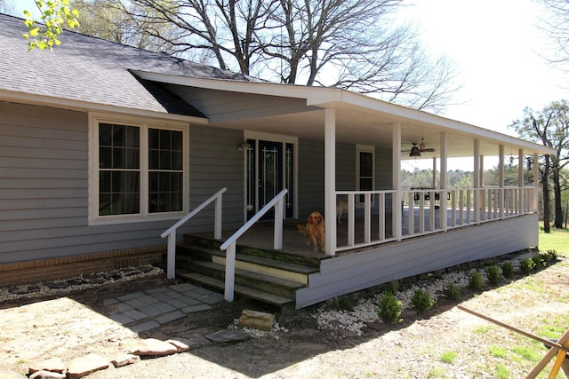 property entrance featuring covered porch and ceiling fan