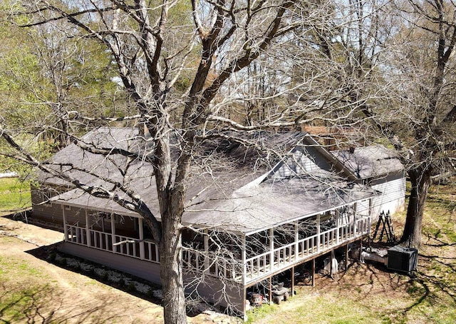 back of house featuring a sunroom