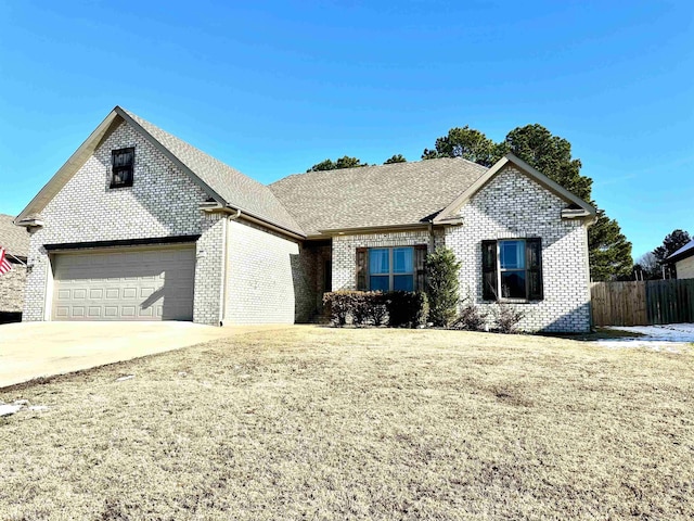 ranch-style home featuring a garage