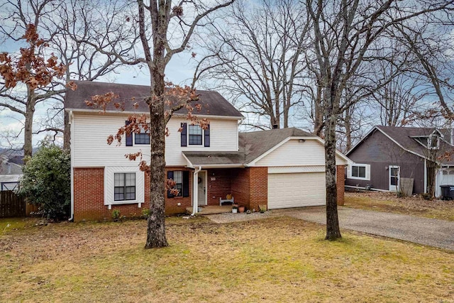 view of front of property featuring a front lawn and a garage