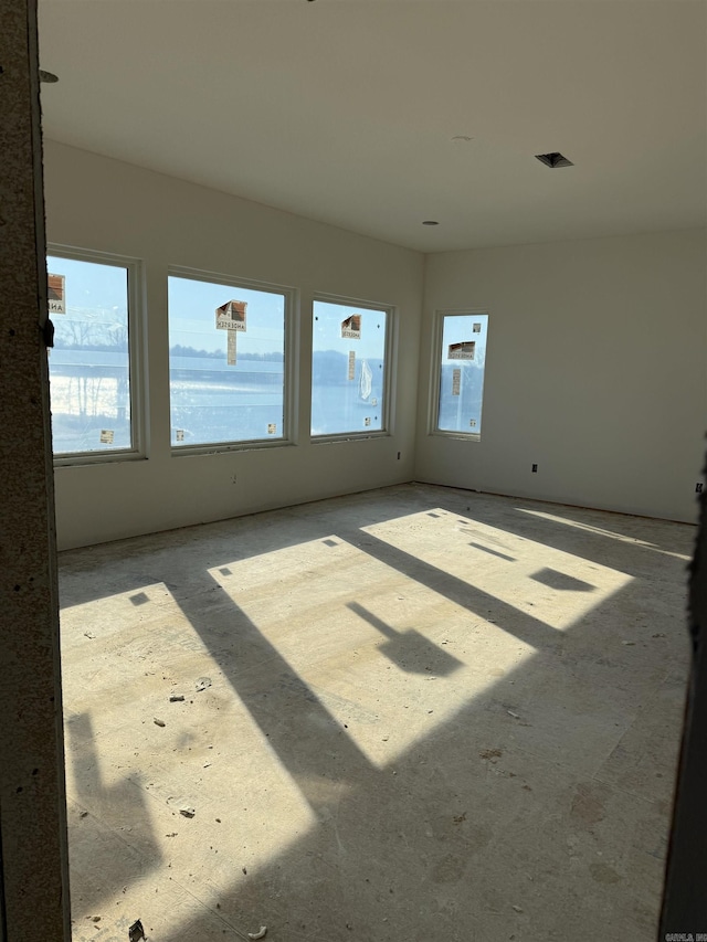 empty room featuring a water view