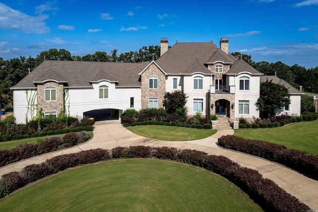 french country home with a front lawn