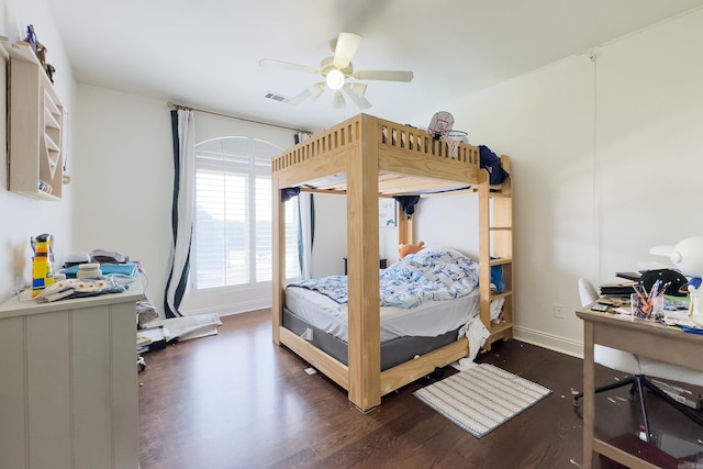 bedroom with dark hardwood / wood-style floors and ceiling fan