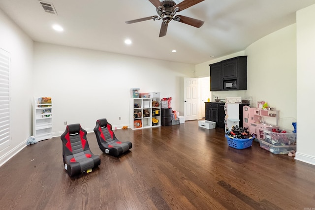 rec room featuring ceiling fan and dark wood-type flooring