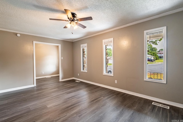 empty room with ceiling fan, dark hardwood / wood-style flooring, a textured ceiling, and ornamental molding