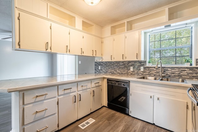 kitchen with decorative backsplash, a textured ceiling, sink, dishwasher, and white cabinetry