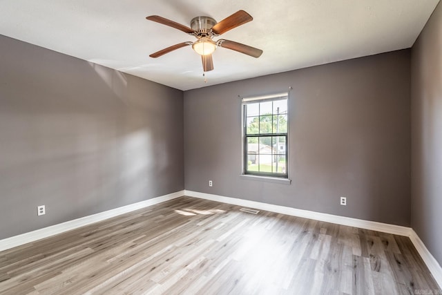 unfurnished room featuring ceiling fan and light wood-type flooring