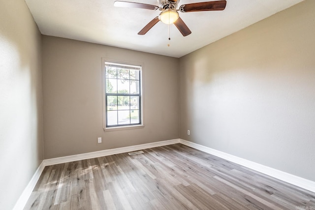 empty room featuring ceiling fan and light hardwood / wood-style flooring