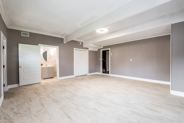 spare room with beam ceiling