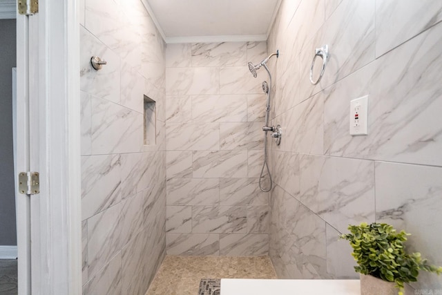 bathroom with tiled shower