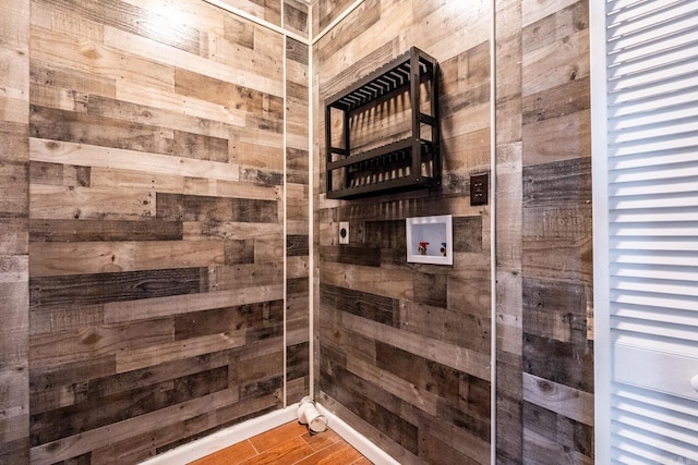 bathroom with wood walls