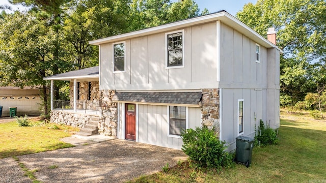 exterior space with a porch and a front lawn