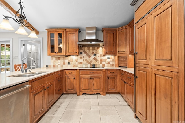 kitchen with backsplash, stainless steel dishwasher, wall chimney exhaust hood, sink, and pendant lighting