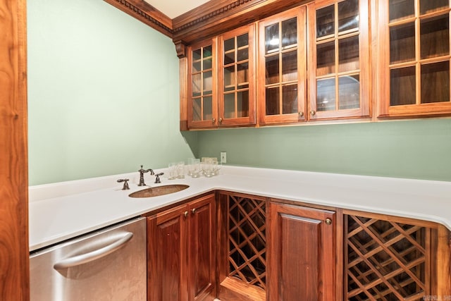 bar featuring stainless steel dishwasher, ornamental molding, and sink