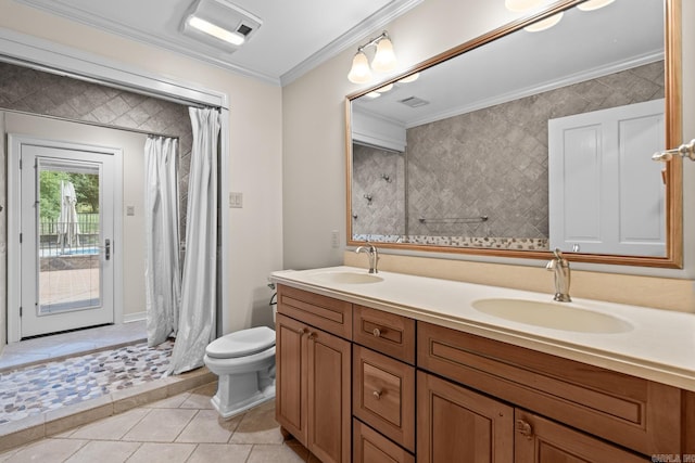 bathroom featuring curtained shower, tile patterned floors, crown molding, toilet, and vanity