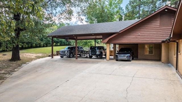 view of parking with a lawn and a carport