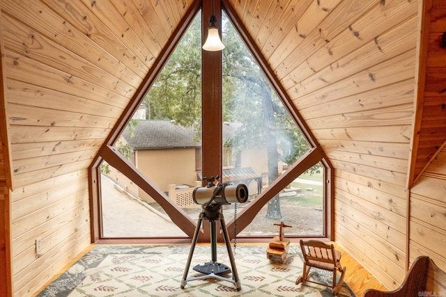 additional living space with wooden walls, wooden ceiling, and vaulted ceiling