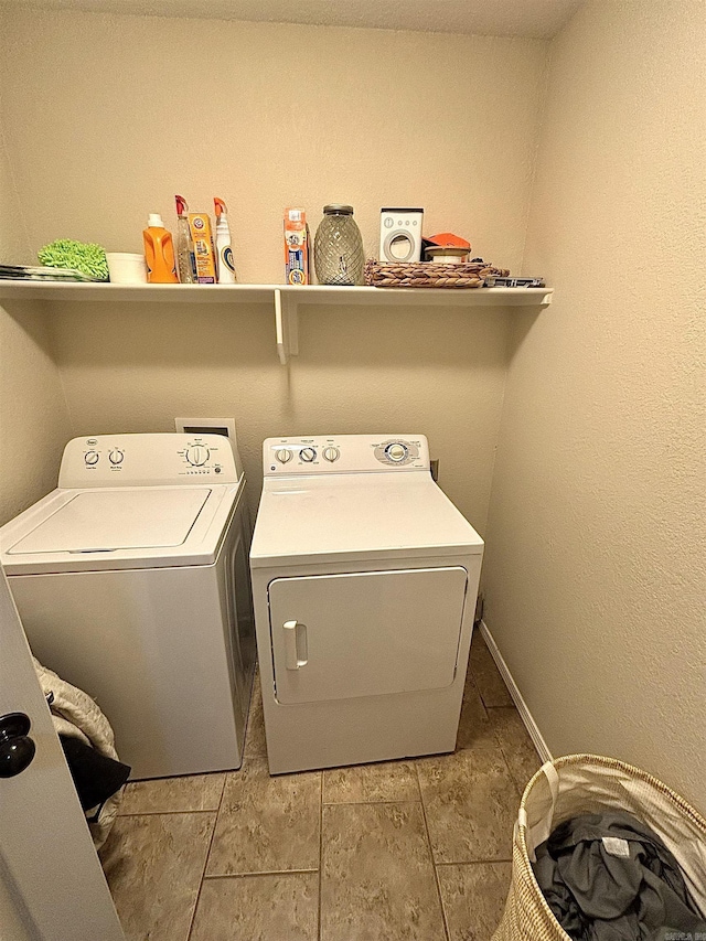 clothes washing area with independent washer and dryer