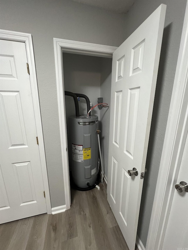 utility room featuring water heater