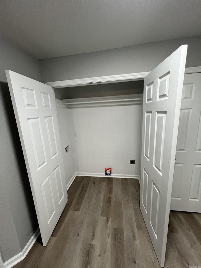 washroom with hookup for a washing machine and hardwood / wood-style floors