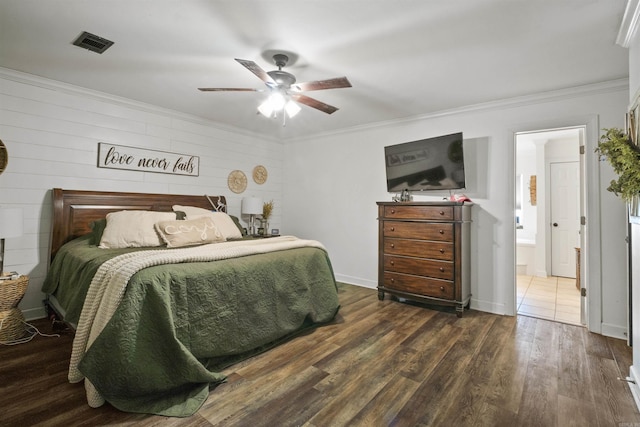 bedroom with visible vents, crown molding, dark wood-type flooring, and ceiling fan